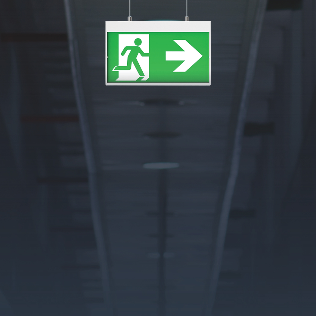 Dark hallway with illuminated exit sign
